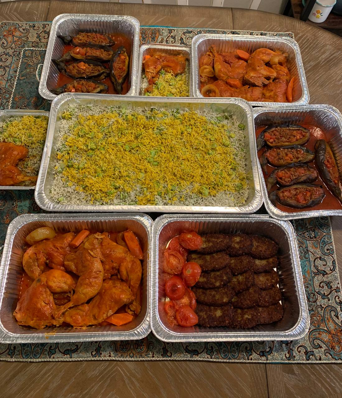 A warm portrait of Chef Narges in her kitchen.