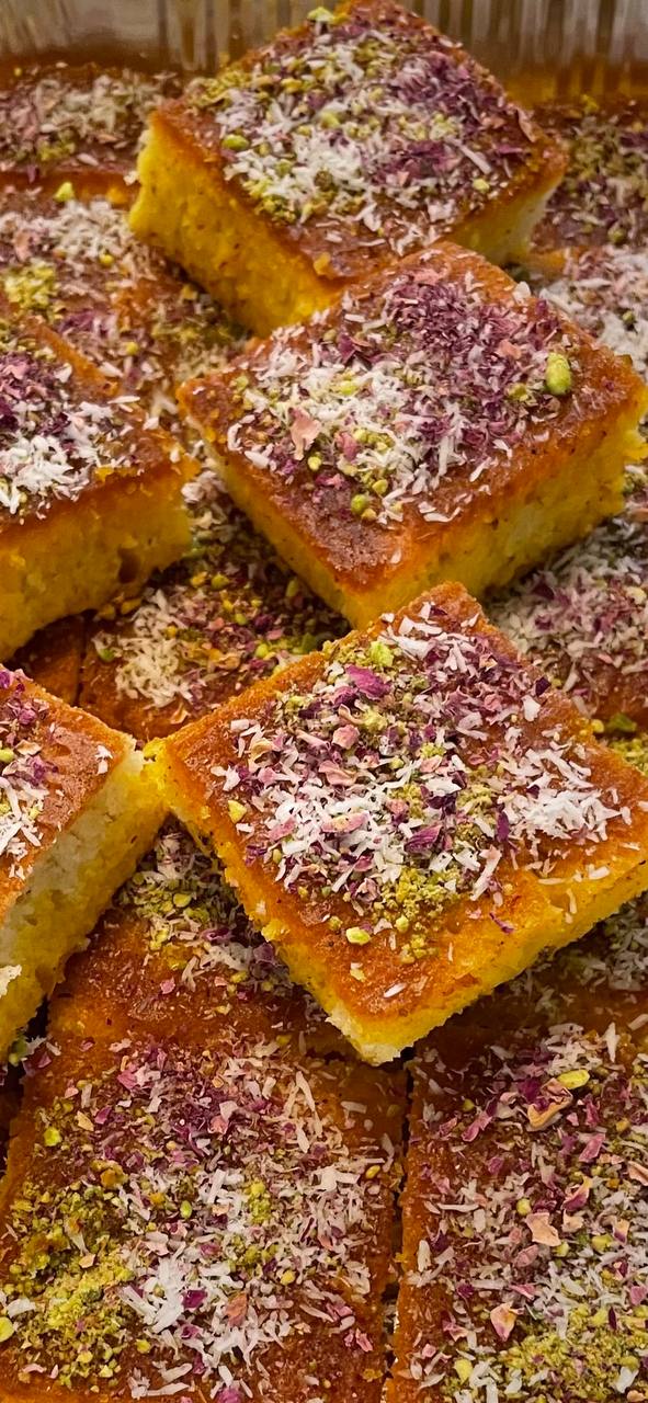 Golden layers of Baklava Royale drizzled with honey and pistachios.